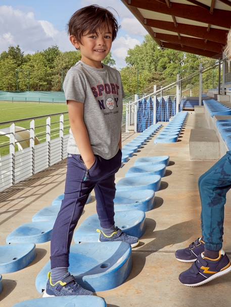 Pantalón de deporte para niño, tejido técnico AZUL OSCURO LISO CON MOTIVOS 